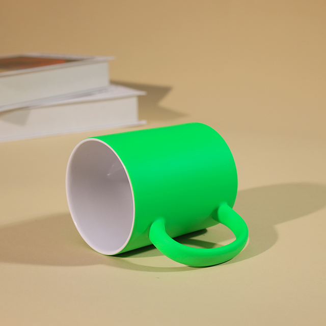 Green interior white ceramic magic mug